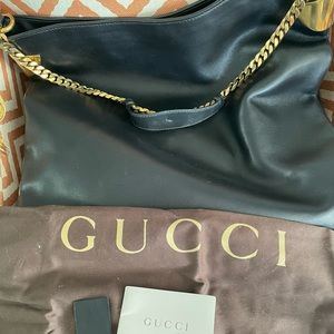 Gucci hobo gold tassel bag.